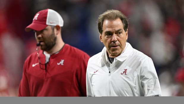 Alabama Crimson Tide head coach Nick Saban runs off the field before playing against the Georgia Bulldogs during the 2022 CFP college football national championship game at Lucas Oil Stadium.
